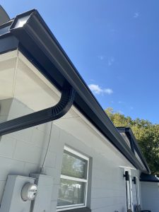 Brand-new black gutter system on a home