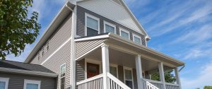 A two-story home with white gutters