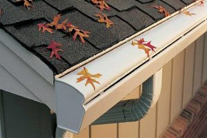 Gutter guards blocking fall leaves from entering the gutter system of a home